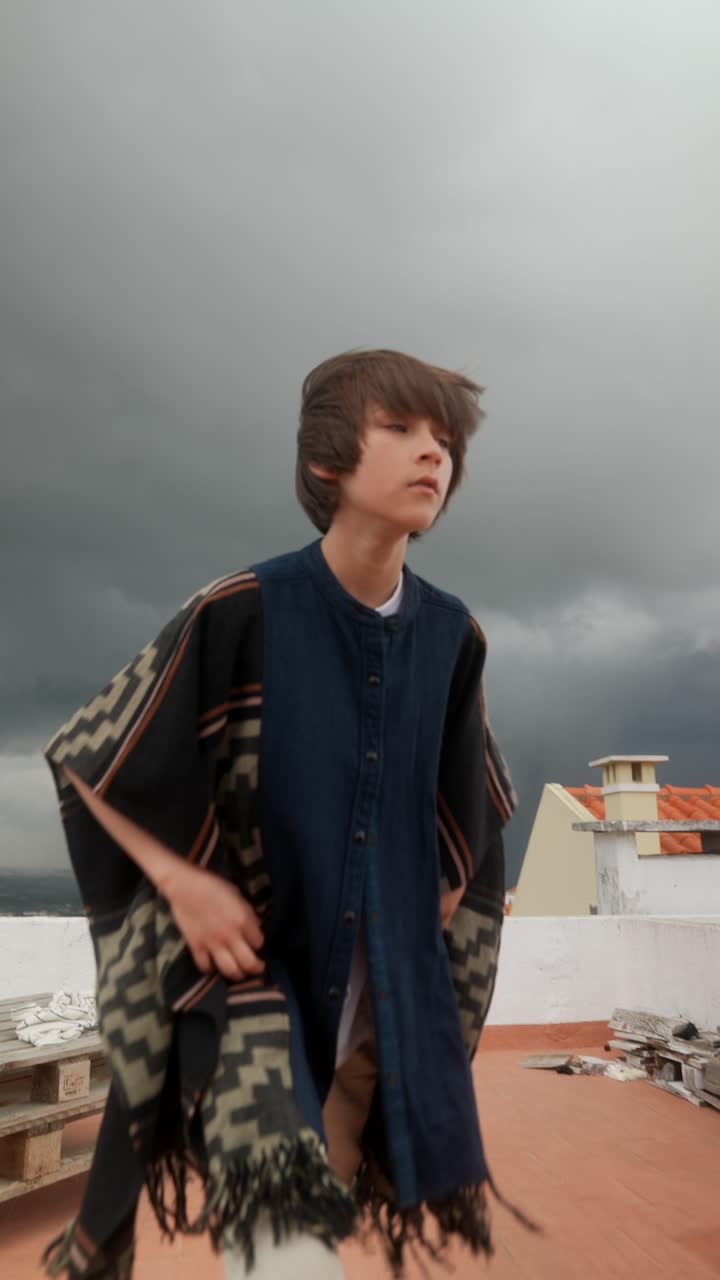 Boy on a Rooftop During a Storm