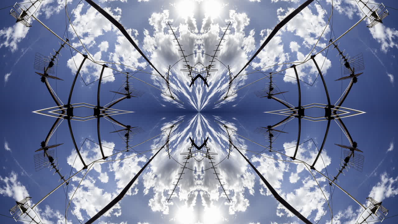 A timelapse of the sky and clouds with television aerials in the foreground