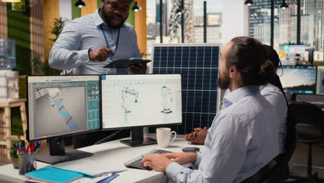 rd office colleagues brainstorming to produce green energy with solar panels