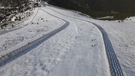 aerial view of a ski resort in navacerrada, madrid, with people skiing in the slope