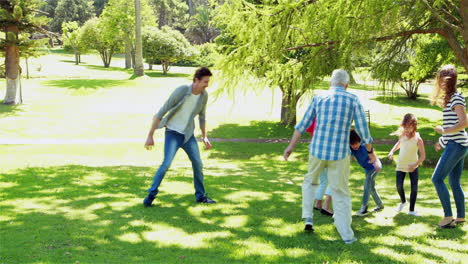 family playing soccer together