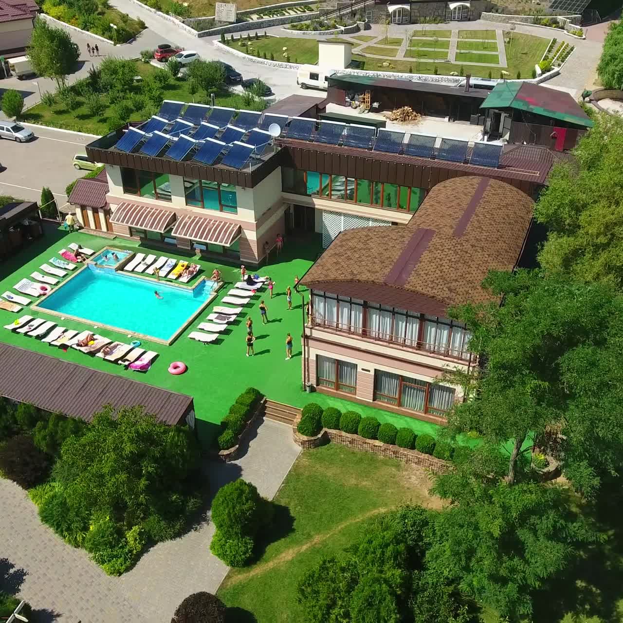 Aerial view of summer holiday pool. Modern resort hotel relaxation