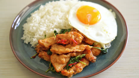 stir-fried-fried-fish-with-basil-and-fried-egg-topped-on-rice---Asian-food-style