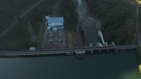aerial tilt shot looking down at iwaya dam hydroelectric power plant, gifu japan