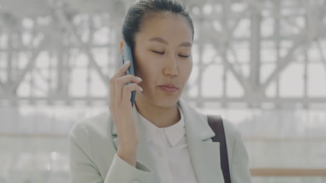 businesswoman on phone call in modern city