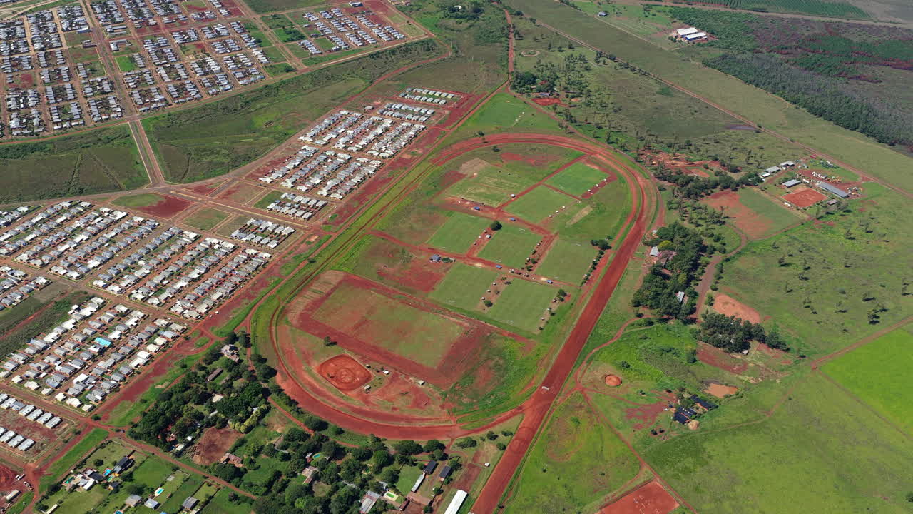 Aerial top view of Posadas Hippodrome in Argentina highlighting oval racetrack and sports infrastructure layout