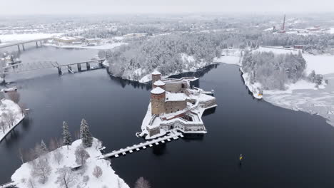 aerial view of olavinlinna castle in winter