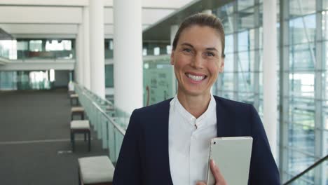 Portrait-of-businesswoman-in-modern-office-building