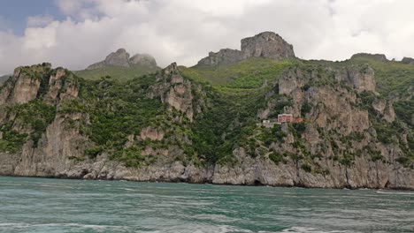 View-from-a-boat-of-the-Amalfi-coast,-a-stretch-of-coastline-in-southern-Italy,-a-UNESCO-Site