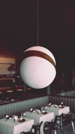 modern restaurant interior with stylish globe pendant lights