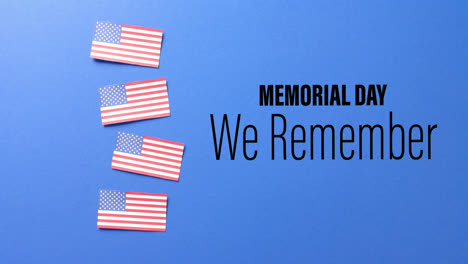 animation of memorial day text over flags of united states of america on blue background