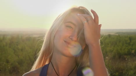 smiling woman outdoors at sunset