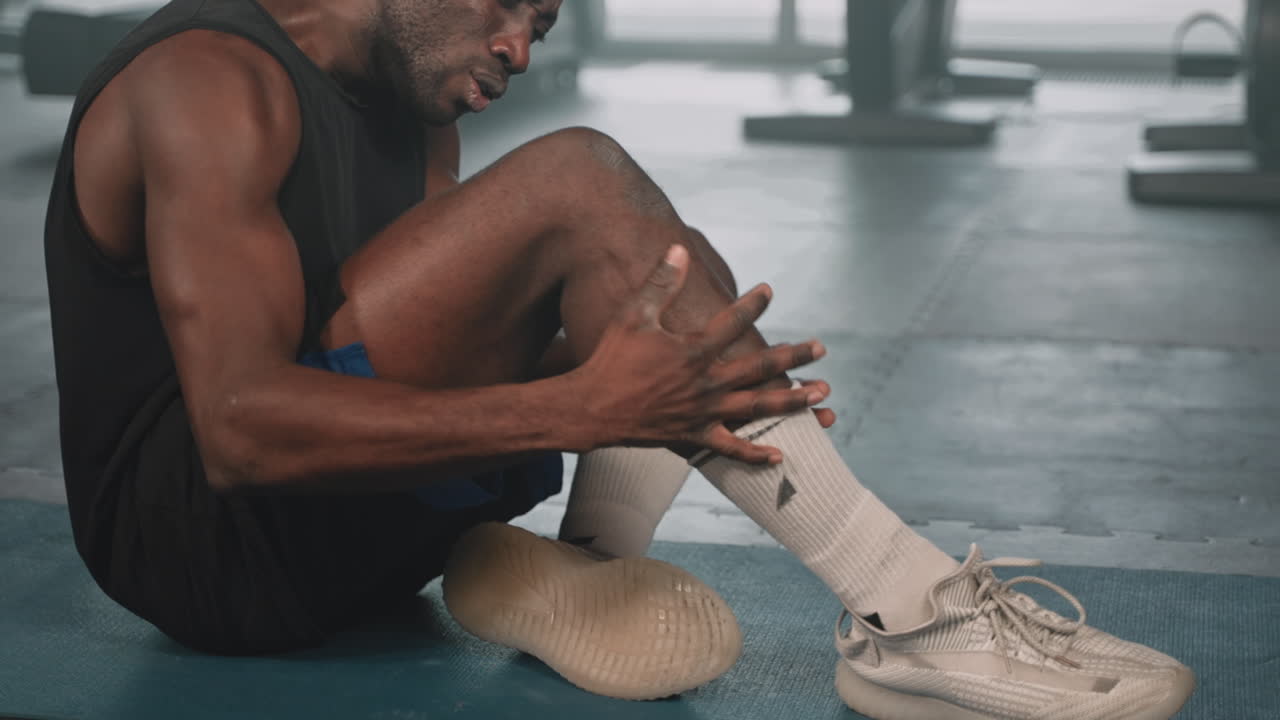 Man with a leg injury in a gym