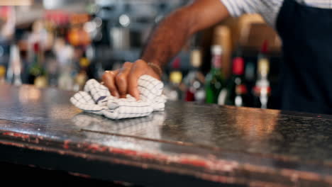 bar staff cleaning counter