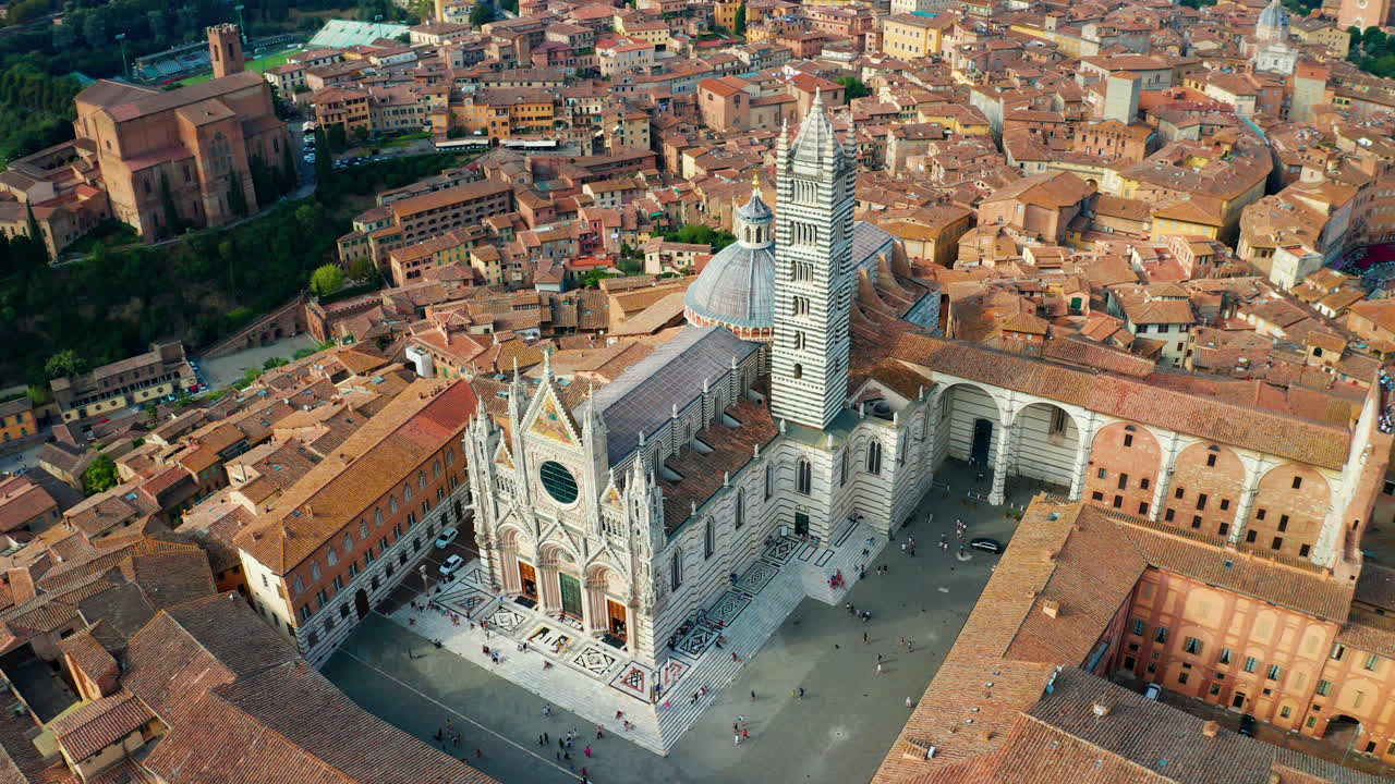 Aerial point of interest shot of the Torre Del Mangia, Siena, Tuscany Italy.