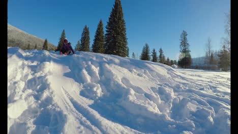 Kid-playing-in-the-snow-during-winter-4k