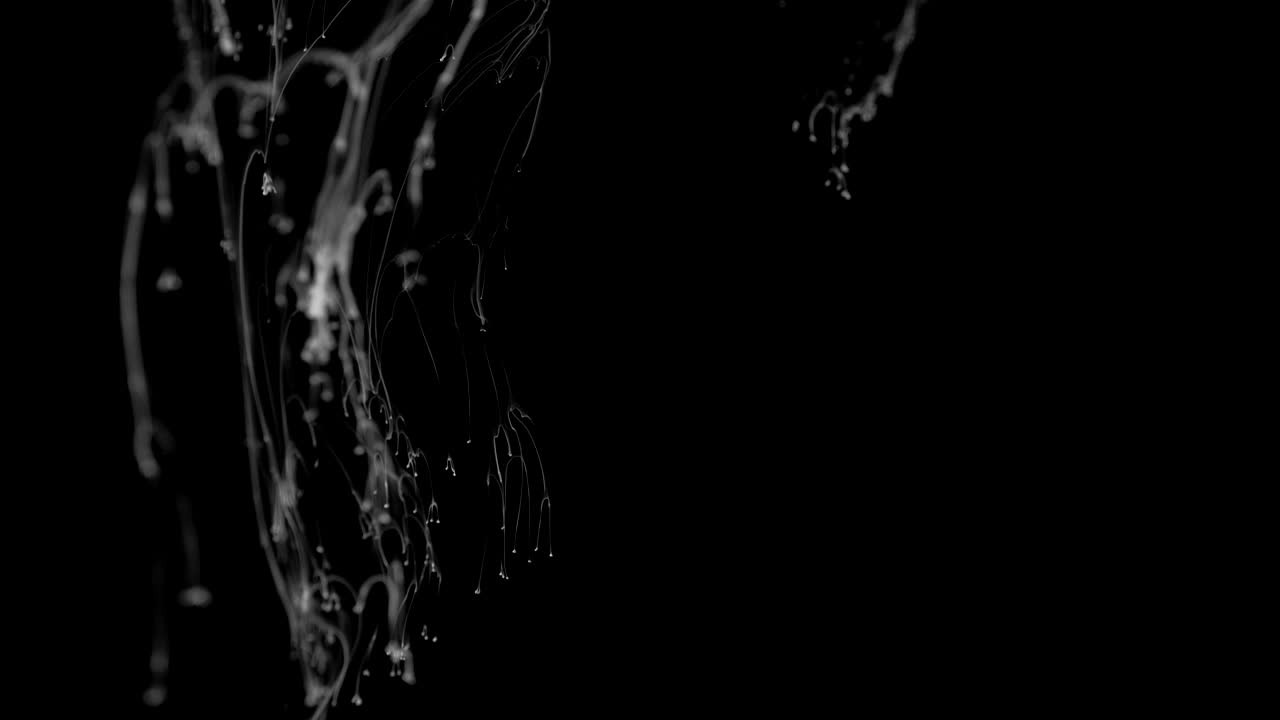 White Ink Effect In Water Filmed On Black Background. Abstract ink creating wonderfully unique cloud formations. Filmed in 4K