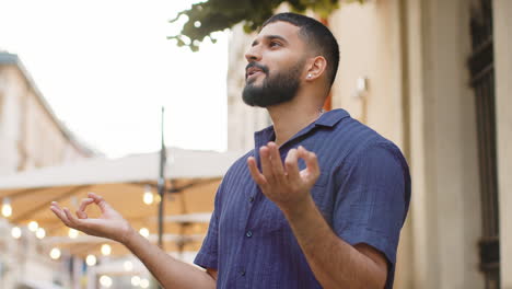 man meditating in the city