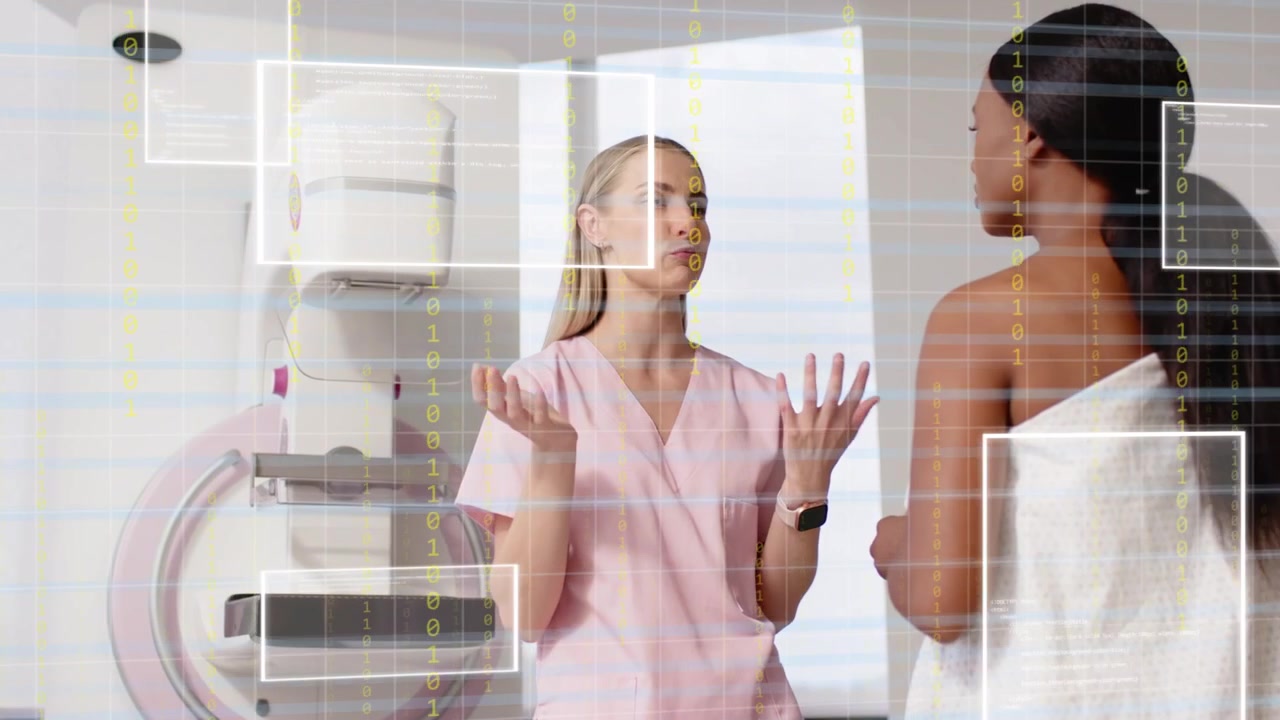 Seorang perawat menjelaskan prosedur pengaturan mammogram, dengan gerakan yang memicu overlay untuk menyoroti pelat, sementara pasien sedang bersiap.