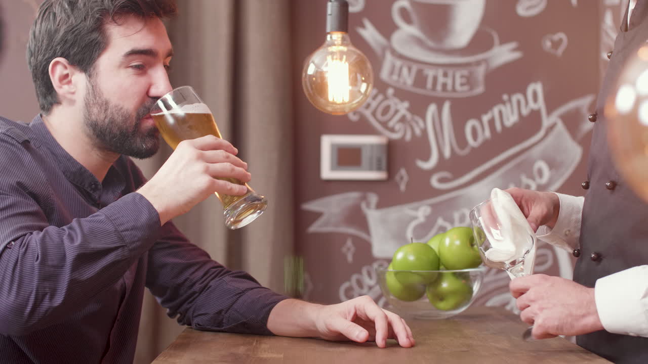 Man having a beer at the bar
