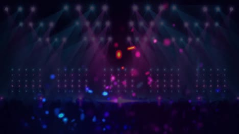 Animation-of-blue-and-pink-spots-of-light-over-dancing-crowd