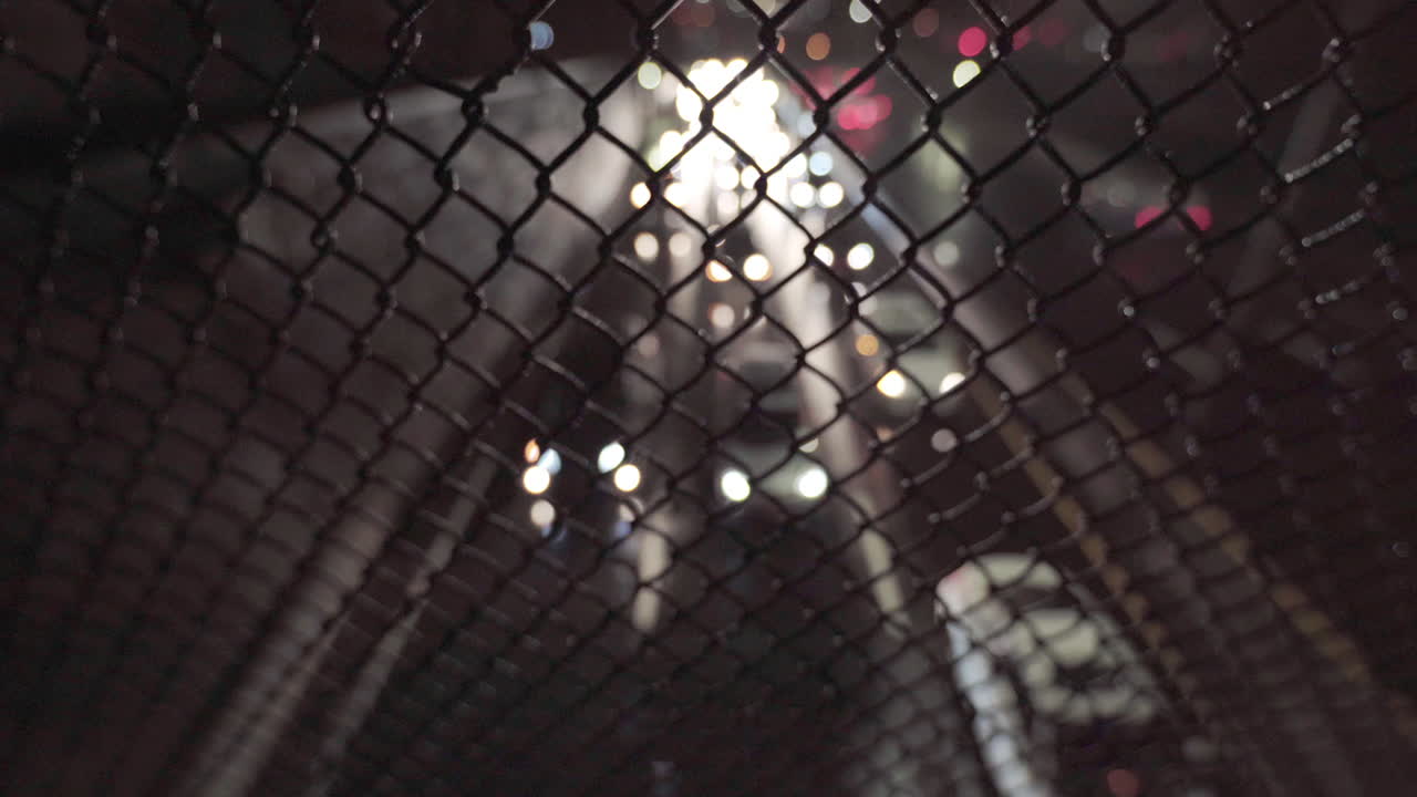 Out of Focus Slow Traffic on Highway Under Heavy Rain, Focus on Fence