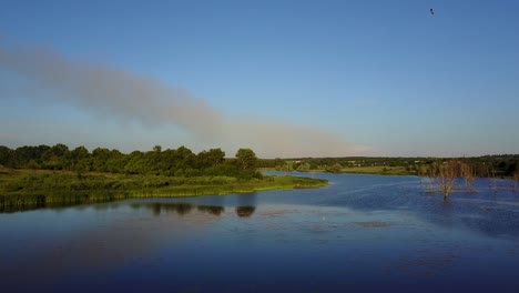 factory pipe polluting air. smoking pipes of thermal power plant against blue sky