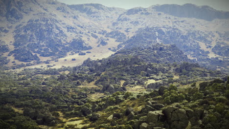 Natural landscape features rocky terrain surrounded by distant mountains