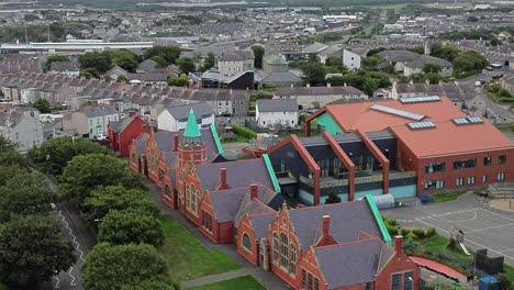 ysgol cybi welsh primary school aerial view circling circling green copper spire and holyhead suburb