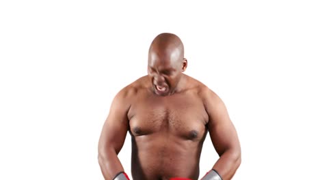 un boxeador musculoso serio con guantes posando