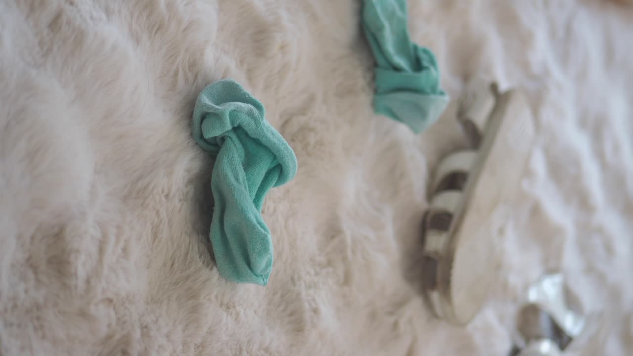 Socks and sandals on carpet
