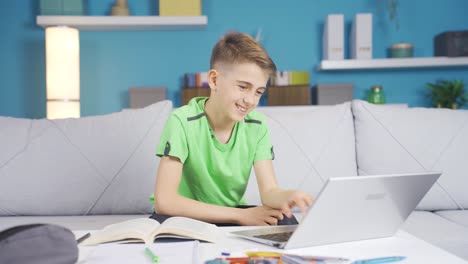 Little-boy-chatting-online-on-computer.