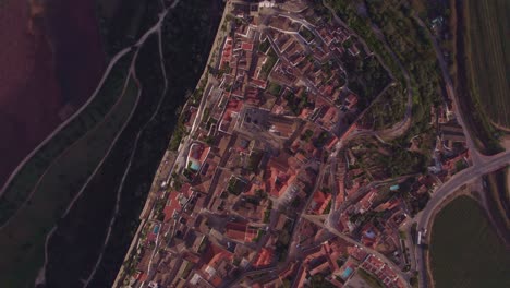 top down of whole medieval city obidos portugal with golden hour, aerial