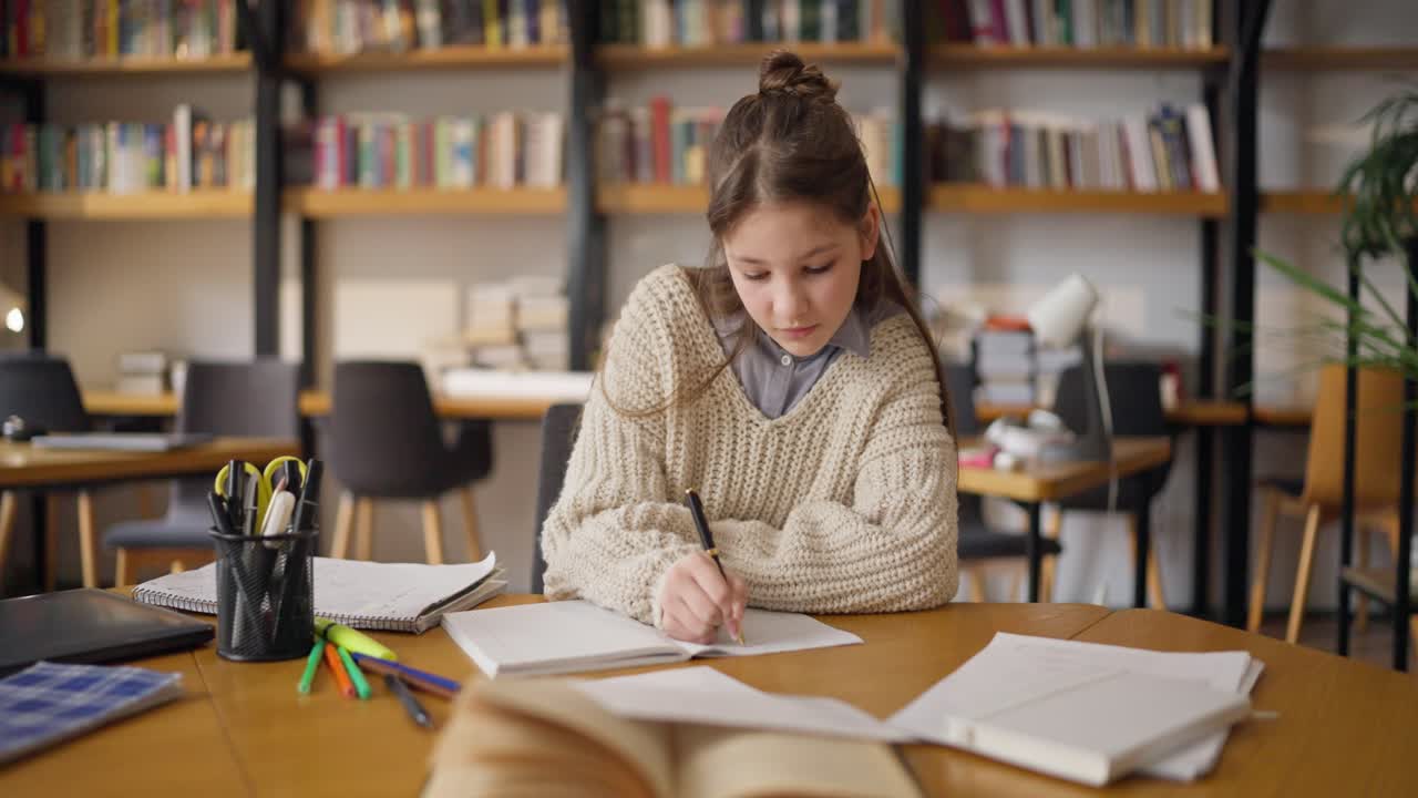 Teenage Girl Studying in a Library