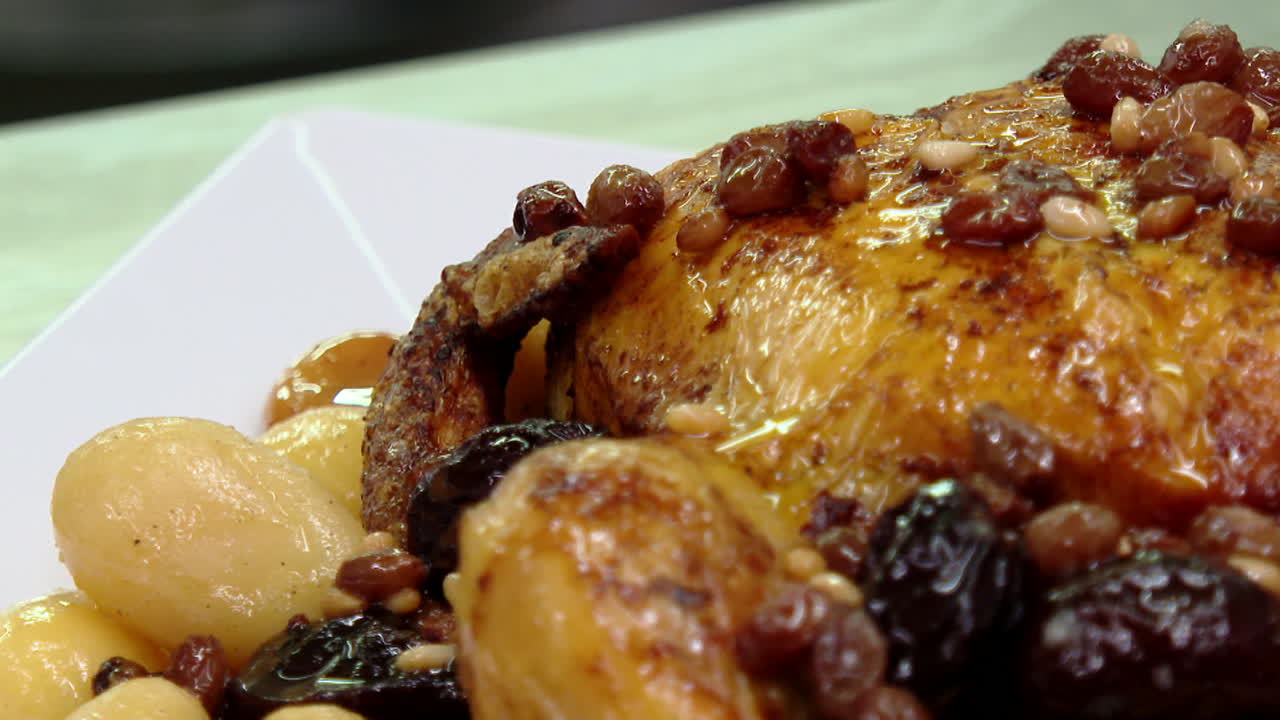 Roasted Chicken with Raisins, Pine Nuts, and Potatoes