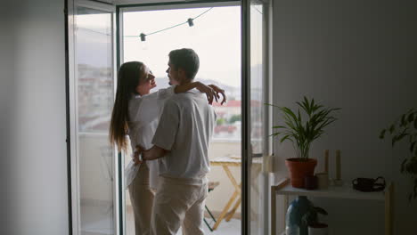 love couple hugging hotel vertical closeup. romantic people moving in dance