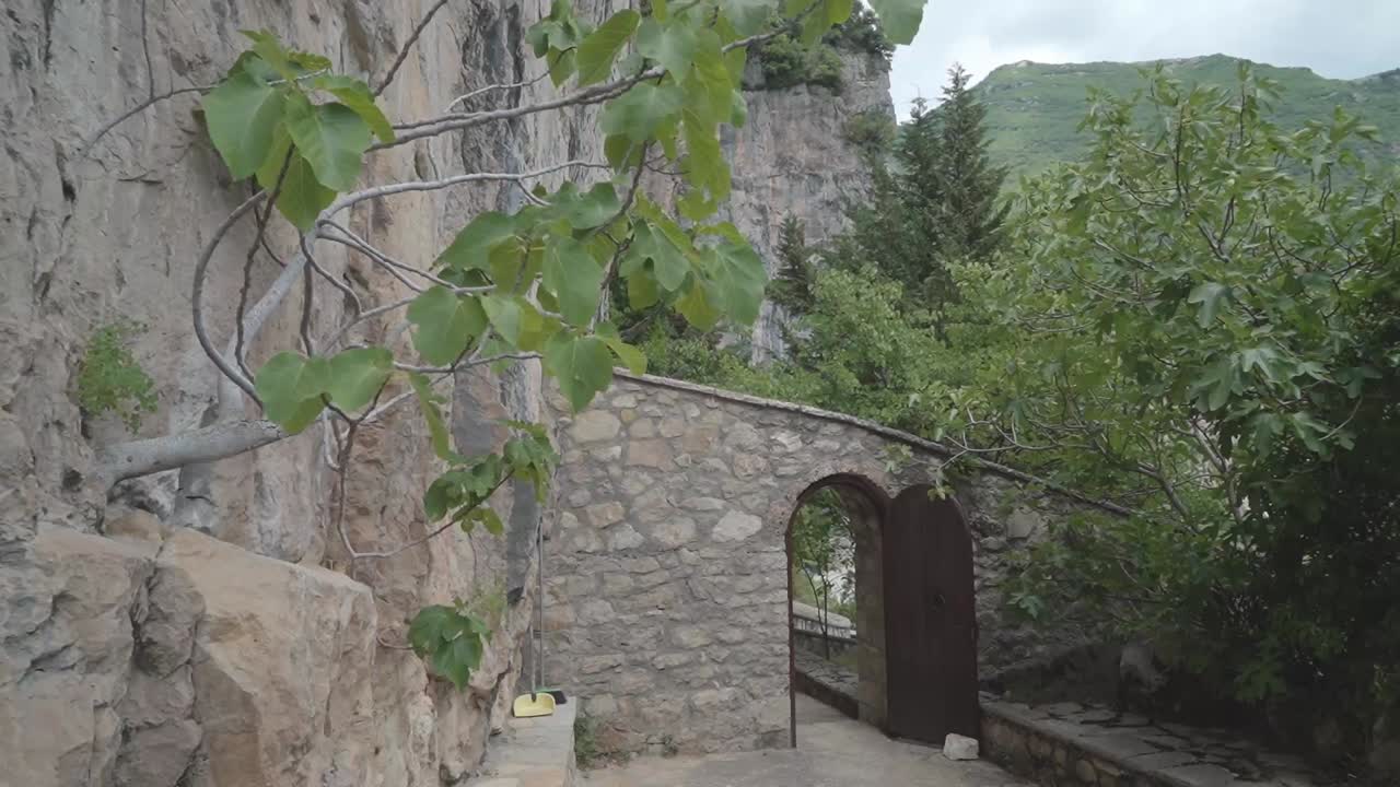 Stone Archway Entrance to a Monastery in the Mountains
