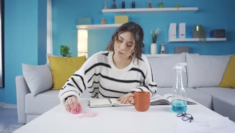 Woman-cleans-spilled-liquid-stain-on-her-desk.