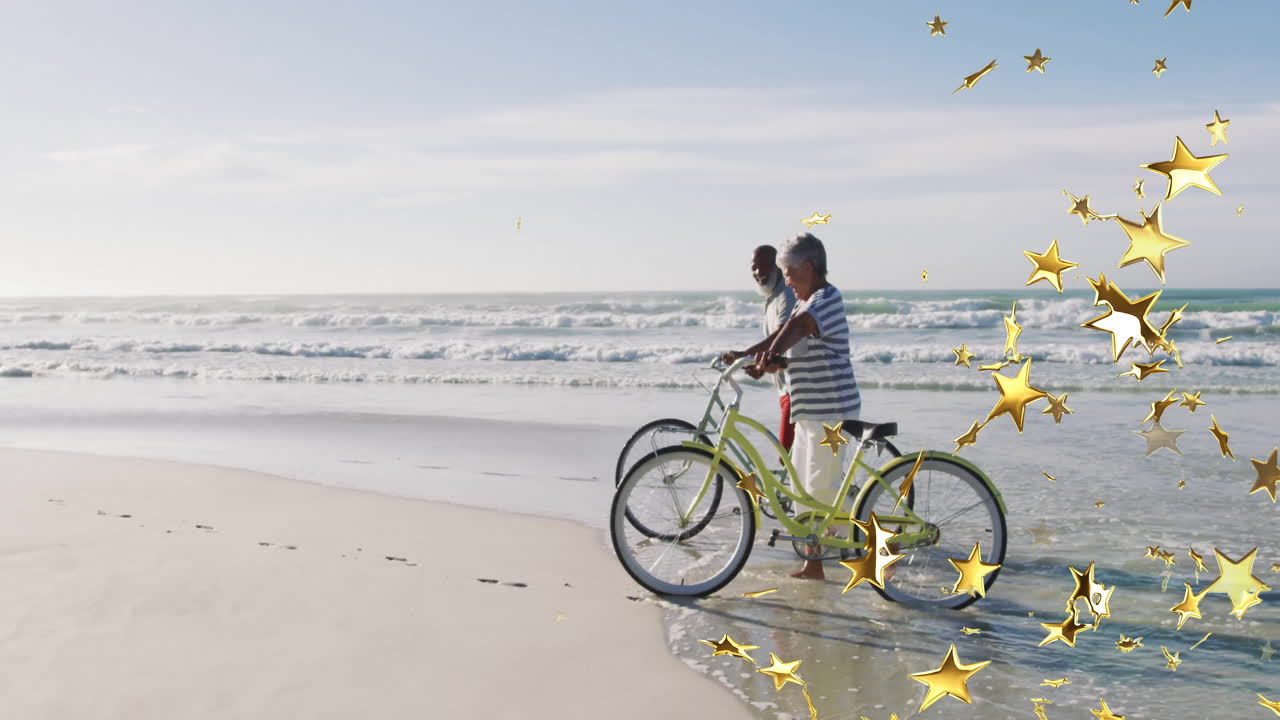 Elderly couple riding bicycles on beach with golden star animation overlay