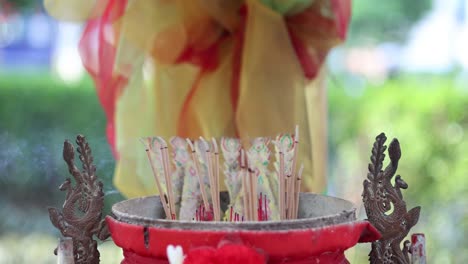 sequential burning of incense sticks at a traditional shrine