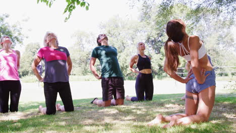 Female-Instructor-Leading-Outdoor-Yoga-Class