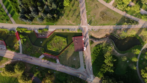aerial view of a modern urban park with water features and walking paths