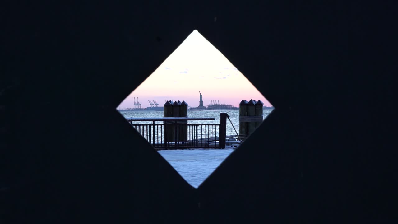 Statue of Liberty viewed through construction window