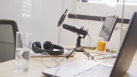 empty room at home with laptop and video equipment on table, slow motion