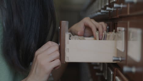woman working in a card catalog