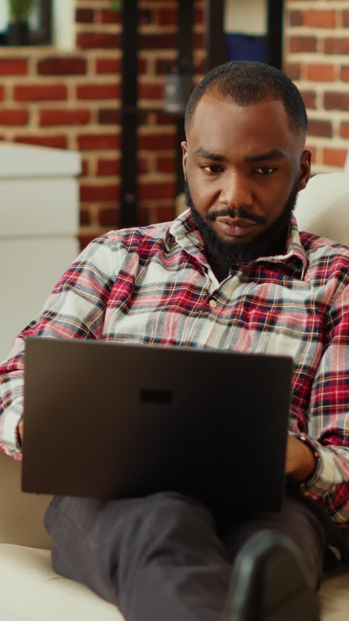 Man working on laptop at home