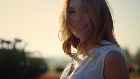 portrait of beautiful woman feeling freedom. pretty girl smiling in summer park.