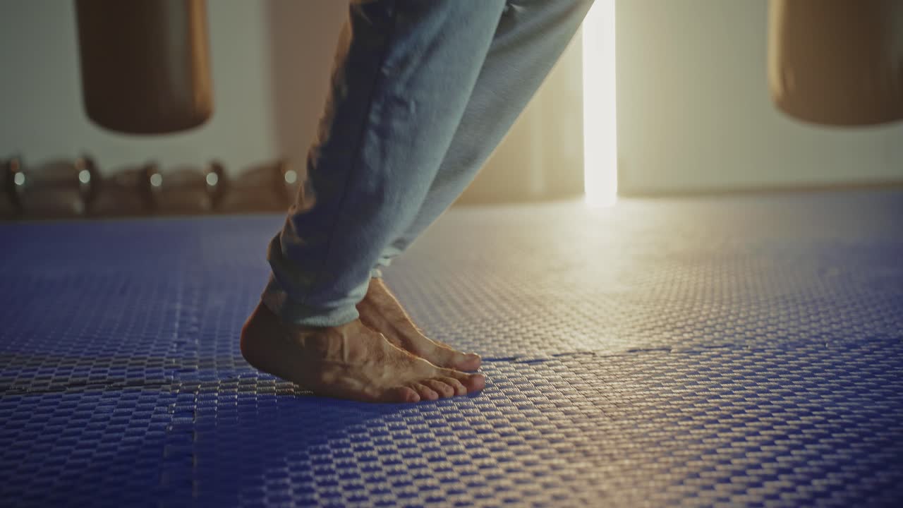 Man doing boxing workout and jumping