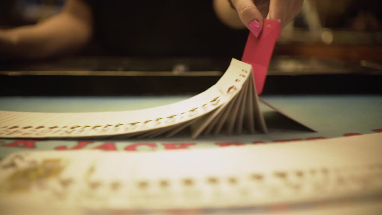 croupier shuffling cards in casino , croupier playing tricks with cards , casino betting life