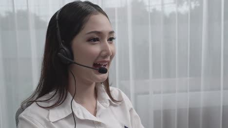 young enthusiastic female customer support operator put on headphone.